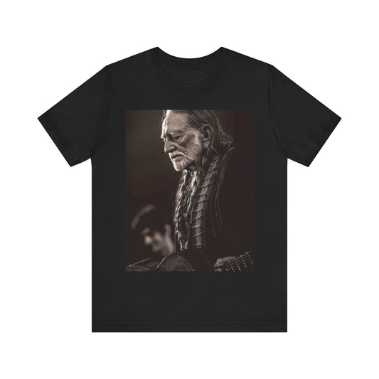 A black graphic t-shirt featuring a vintage country legend graphic of Willie Nelson.