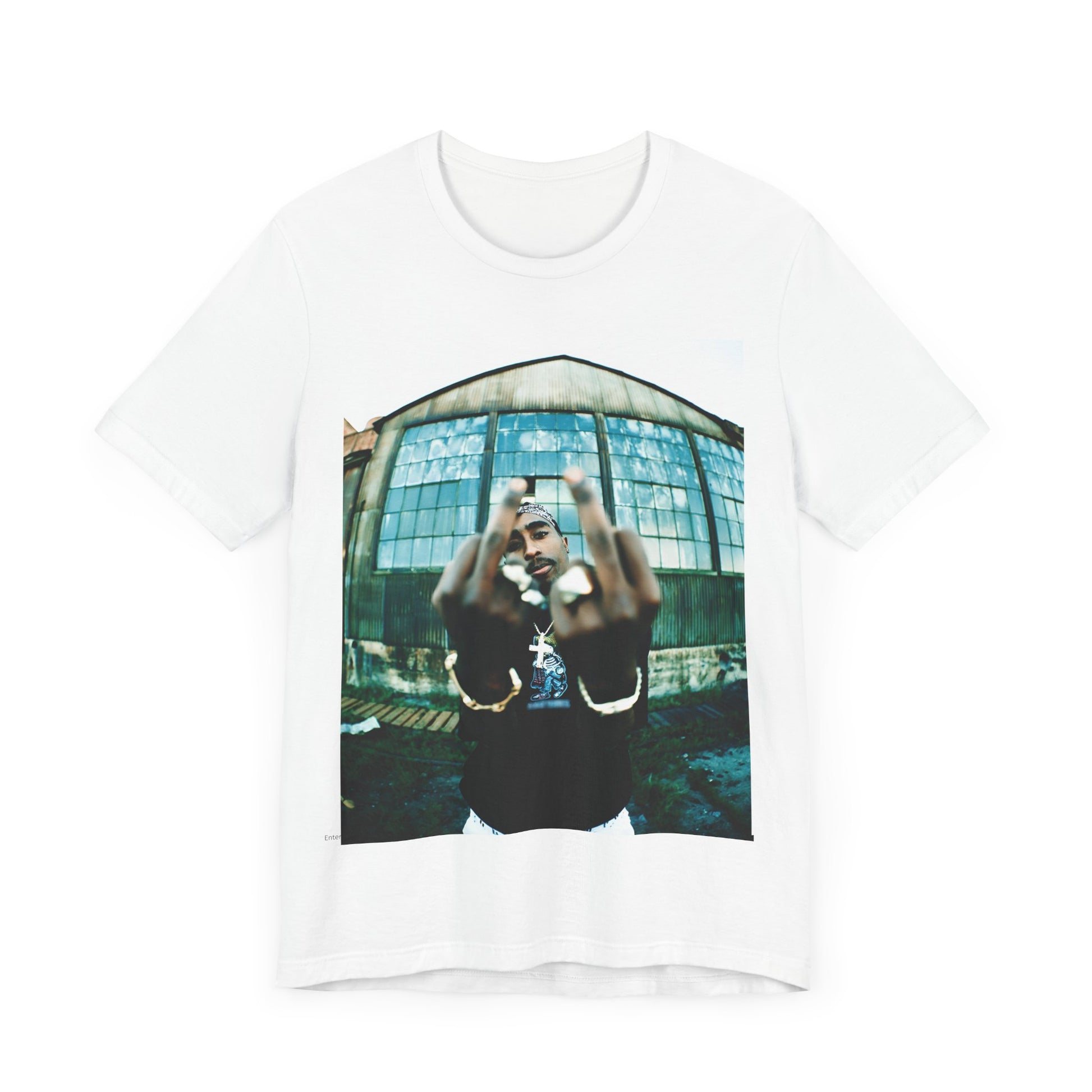 A black graphic t-shirt featuring a graphic of Tupac giving the middle finger.