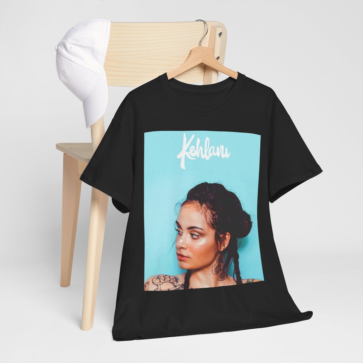 A black graphic t-shirt featuring a rapper aesthetic graphic of Kehlani.