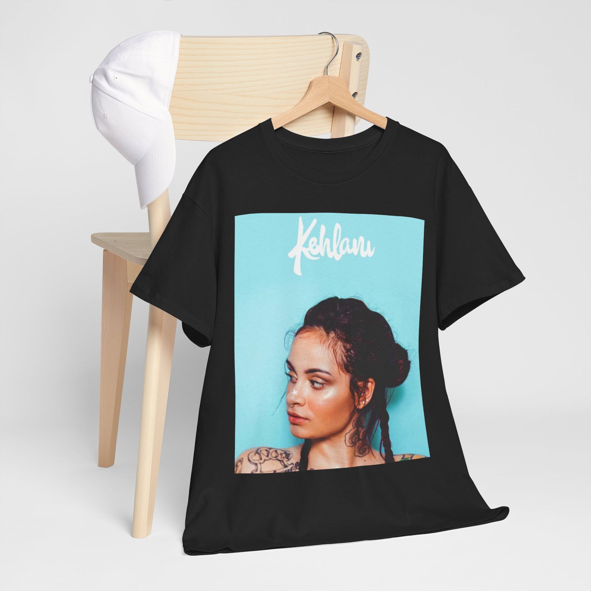 A black graphic t-shirt featuring a rapper aesthetic graphic of Kehlani.