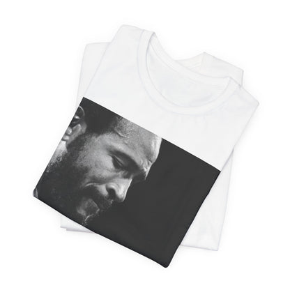 A black graphic t-shirt featuring a 70s graphic of Marvin Gaye emphasizing his soulful voice.