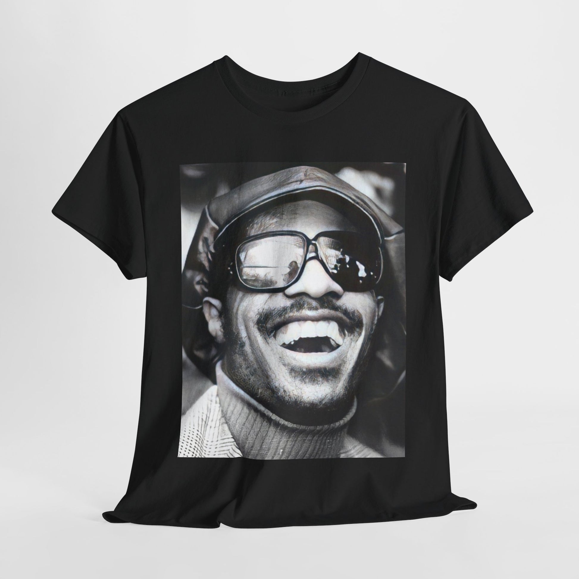 A black graphic t-shirt featuring a black and white portrait photo of Stevie Wonder.