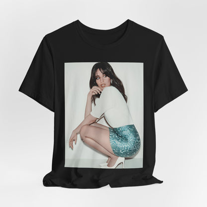 A black graphic t-shirt featuring a stylized graphic of Camila Cabello as a Latin pop princess.