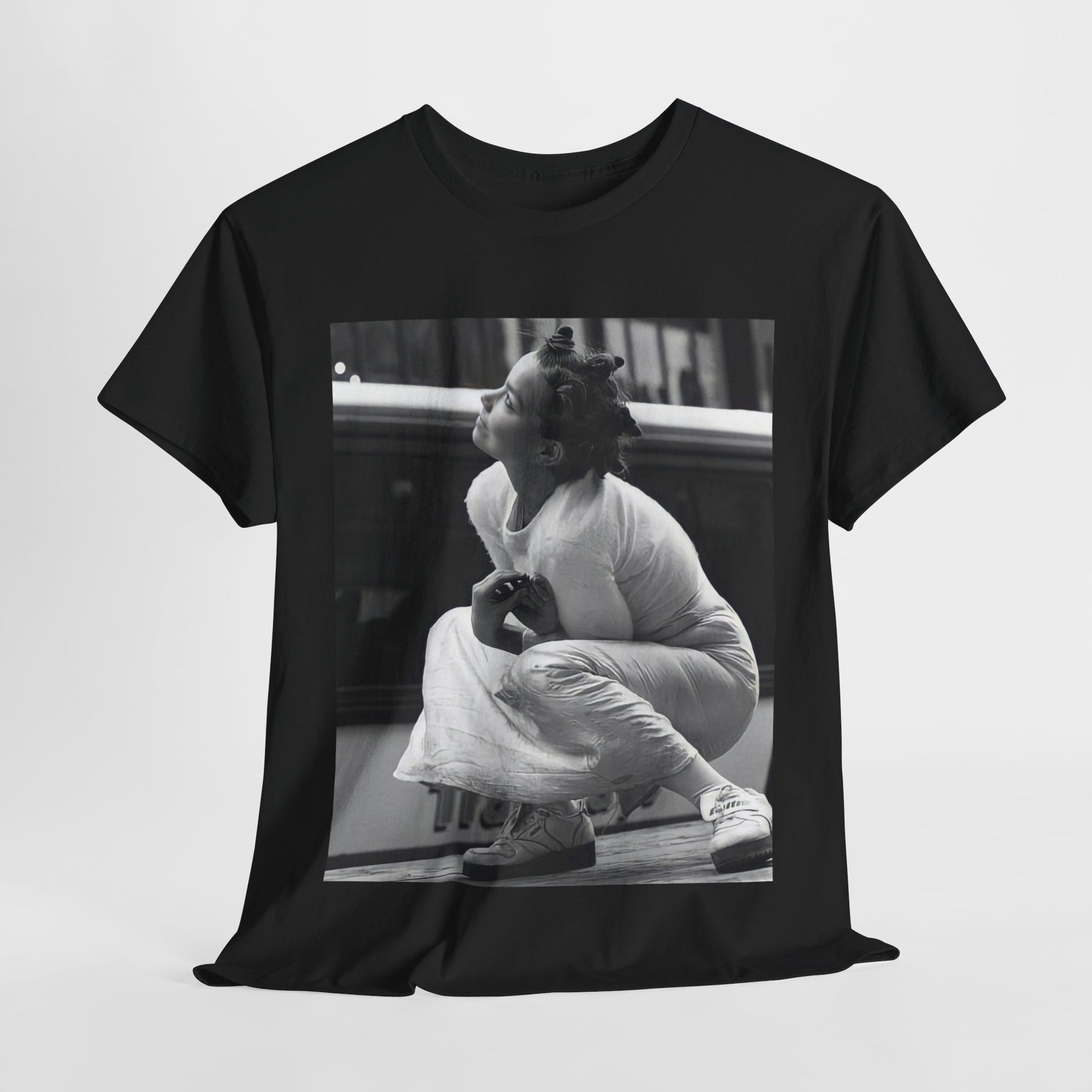 A black graphic t-shirt featuring a graphic of Bjork as an experimental pop icon.