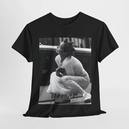 A black graphic t-shirt featuring a graphic of Bjork as an experimental pop icon.