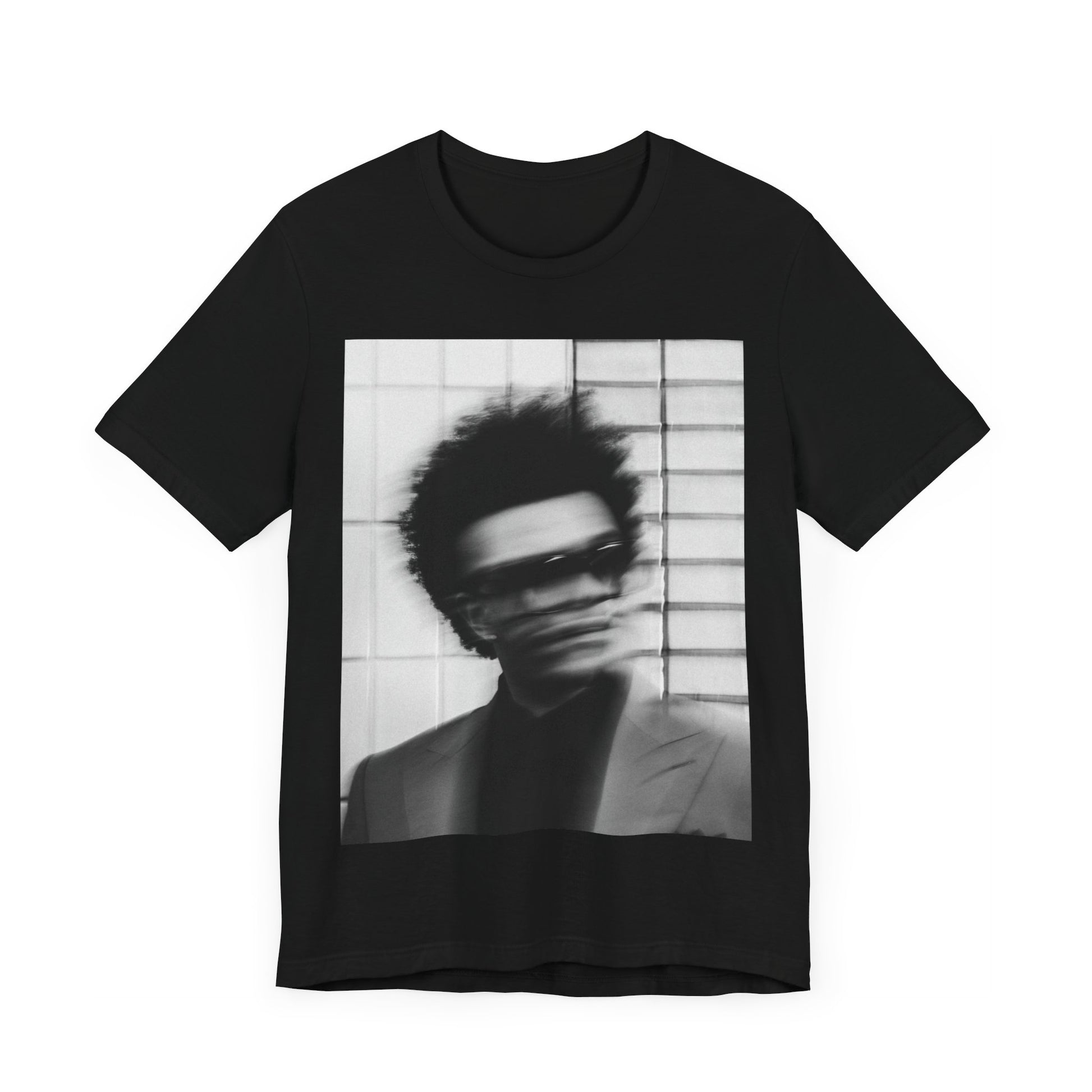A black graphic t-shirt featuring a blurred graphic of The Weeknd from his 'After Hours' era.