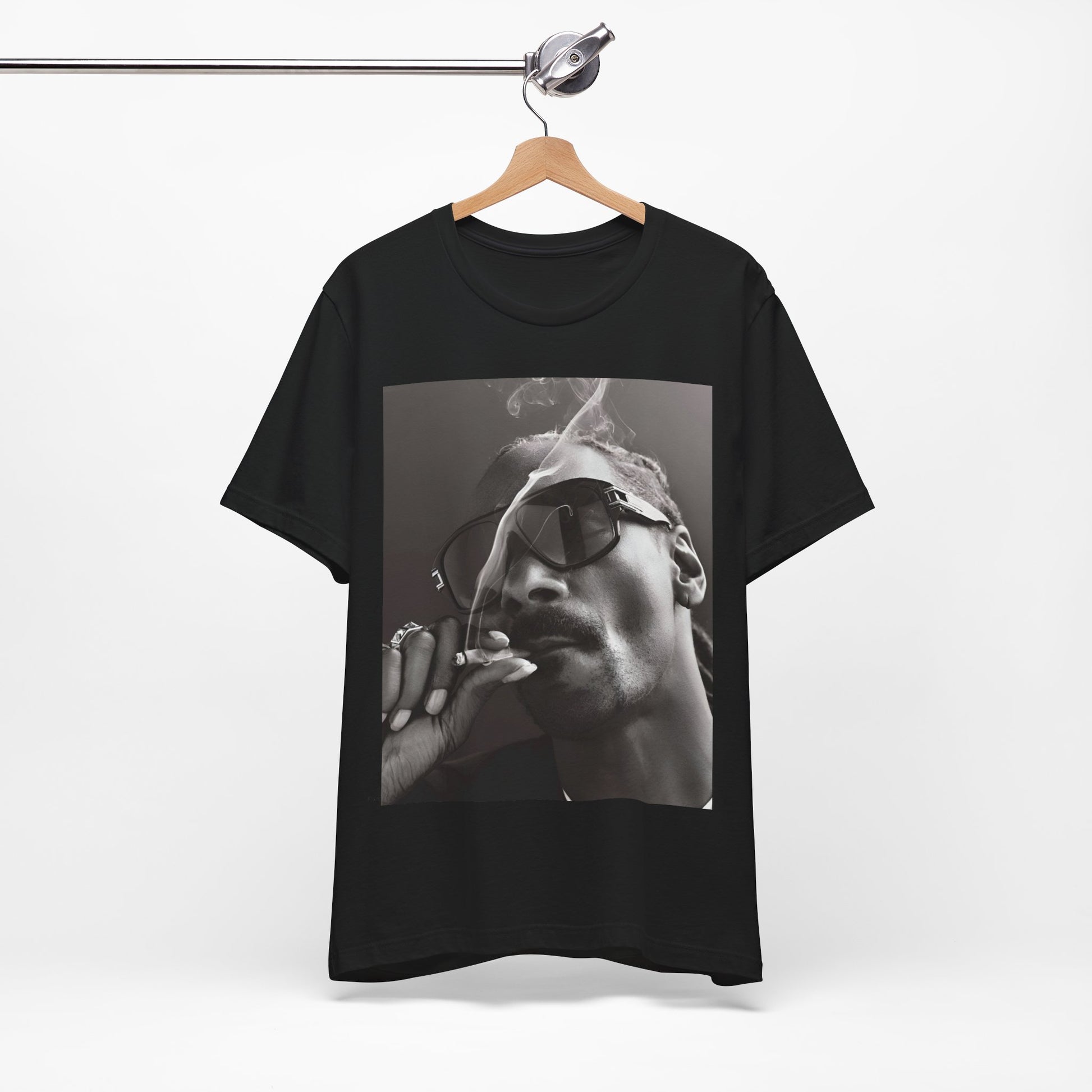 A black graphic t-shirt featuring an iconic black and white shaded portrait graphic of Snoop Dogg.