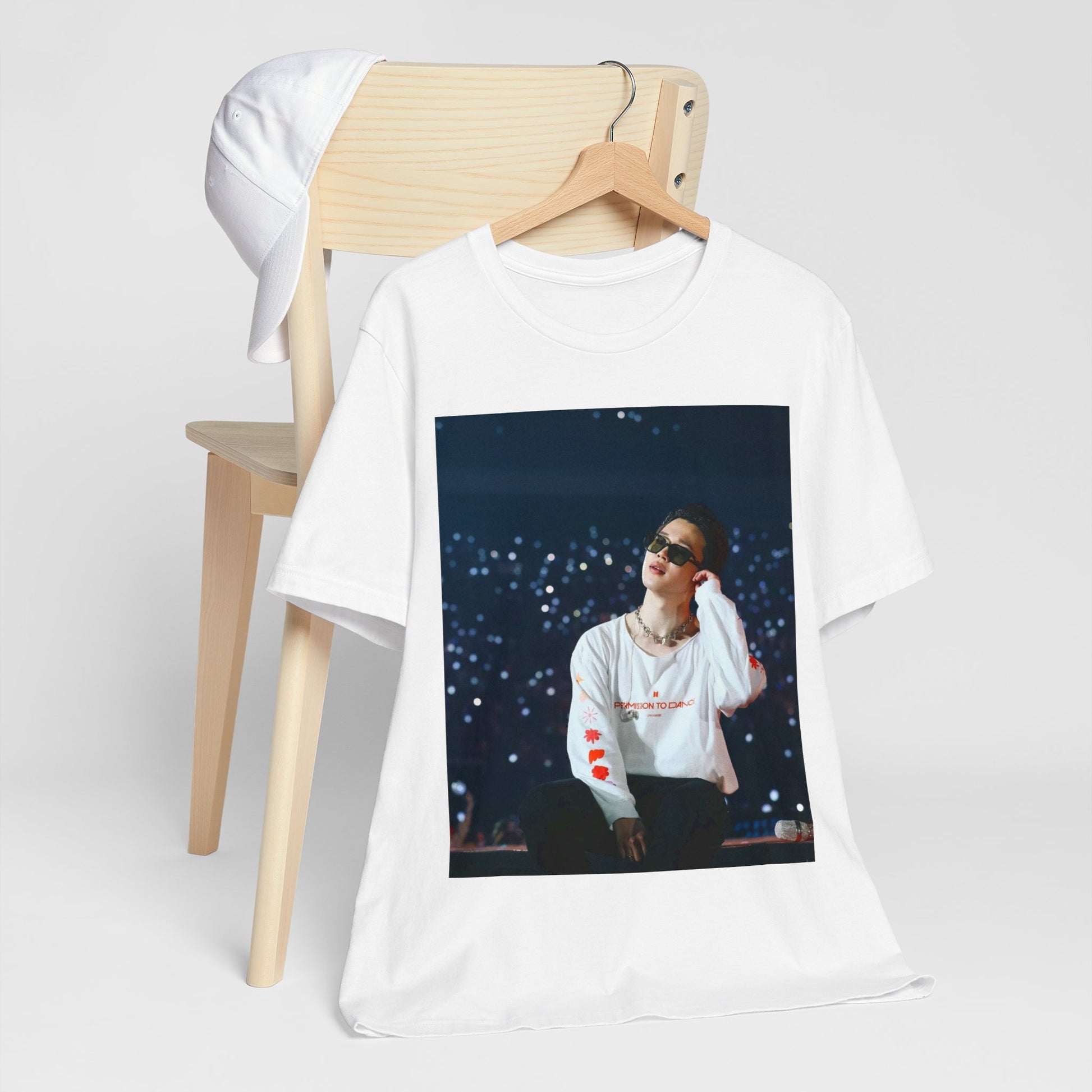 A black graphic t-shirt featuring a vintage aesthetic graphic related to Jimin's 'Lie' era.