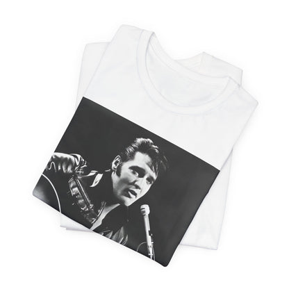 A black graphic t-shirt featuring a graphic related to Elvis Presley's 'Burning Love' song or era.