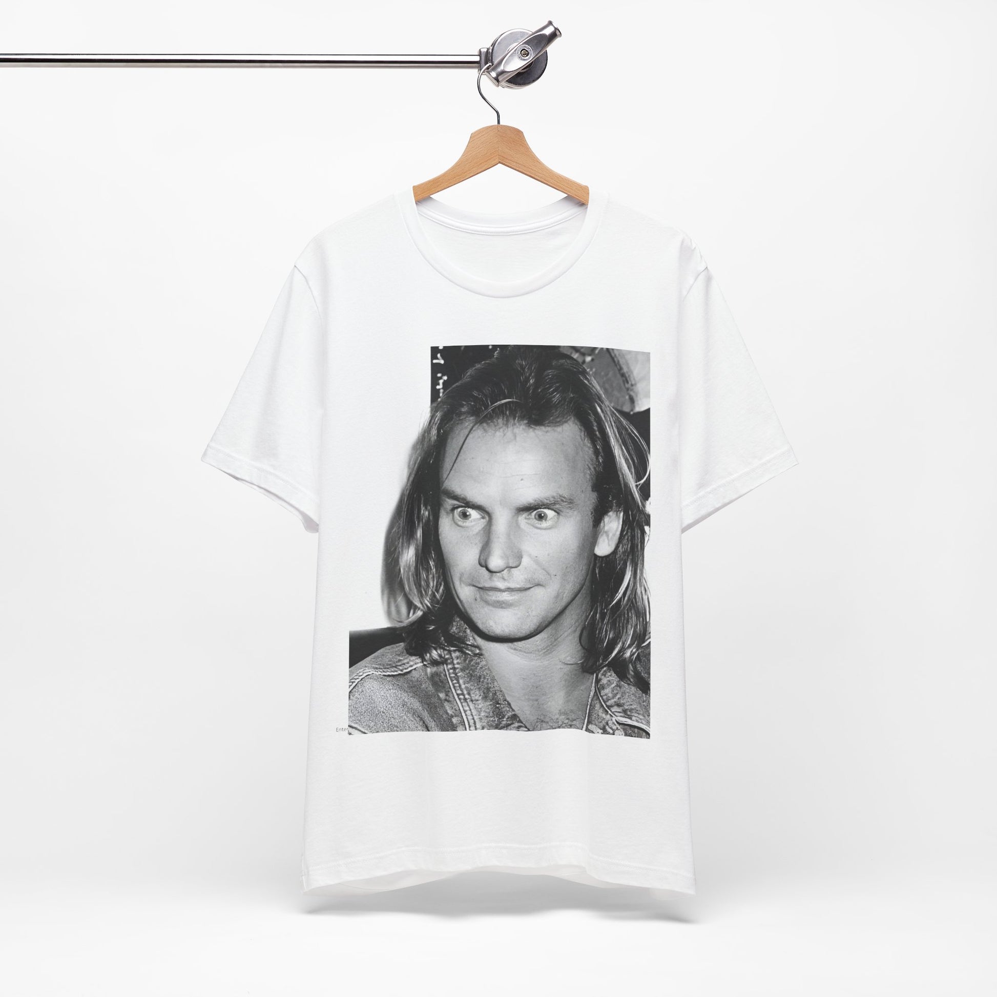 A black graphic t-shirt featuring a retro graphic related to Sting's 'Synchronicity' album era.