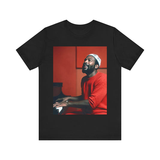 A black graphic t-shirt featuring a graphic of Marvin Gaye with a piano.