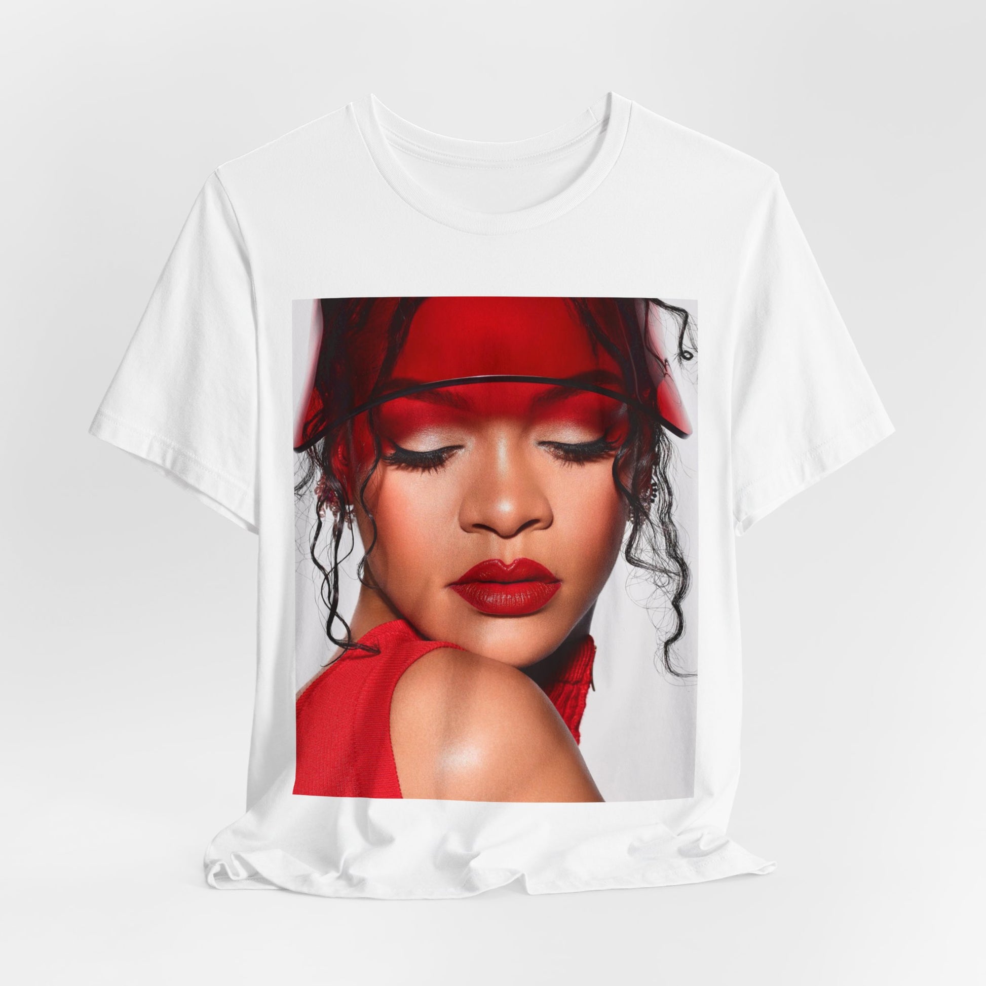 A black graphic t-shirt featuring a casual pop fan graphic of Rihanna.