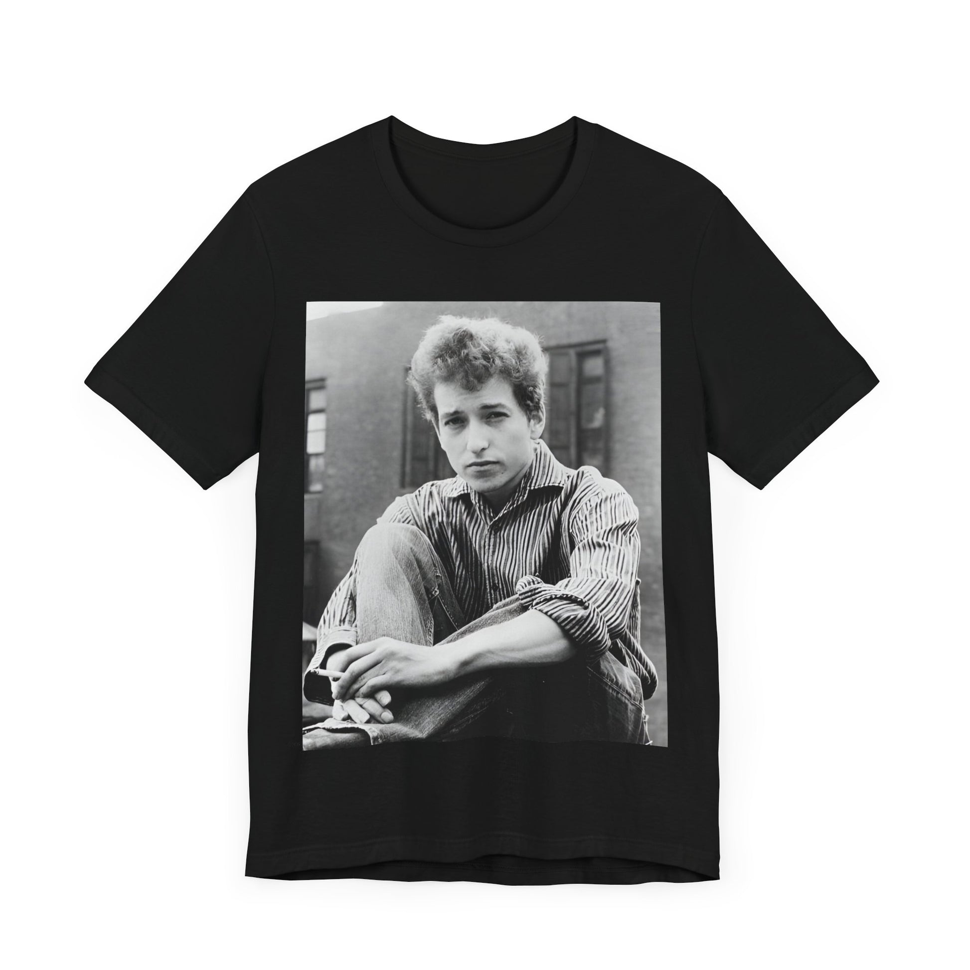 A black graphic t-shirt featuring a graphic of Bob Dylan from his 60s origins in folk music.