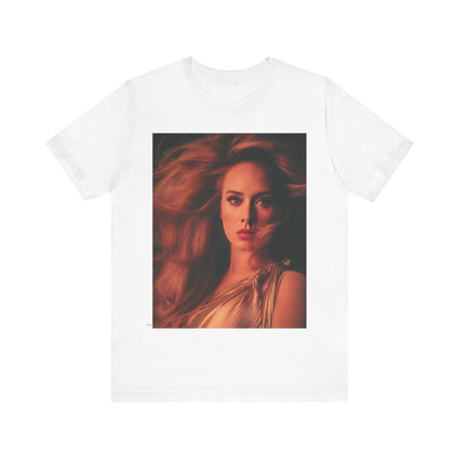 A black graphic t-shirt featuring a glamorous portrait of Adele wearing a golden gown, with voluminous hair, bathed in warm lighting, giving an editorial look.