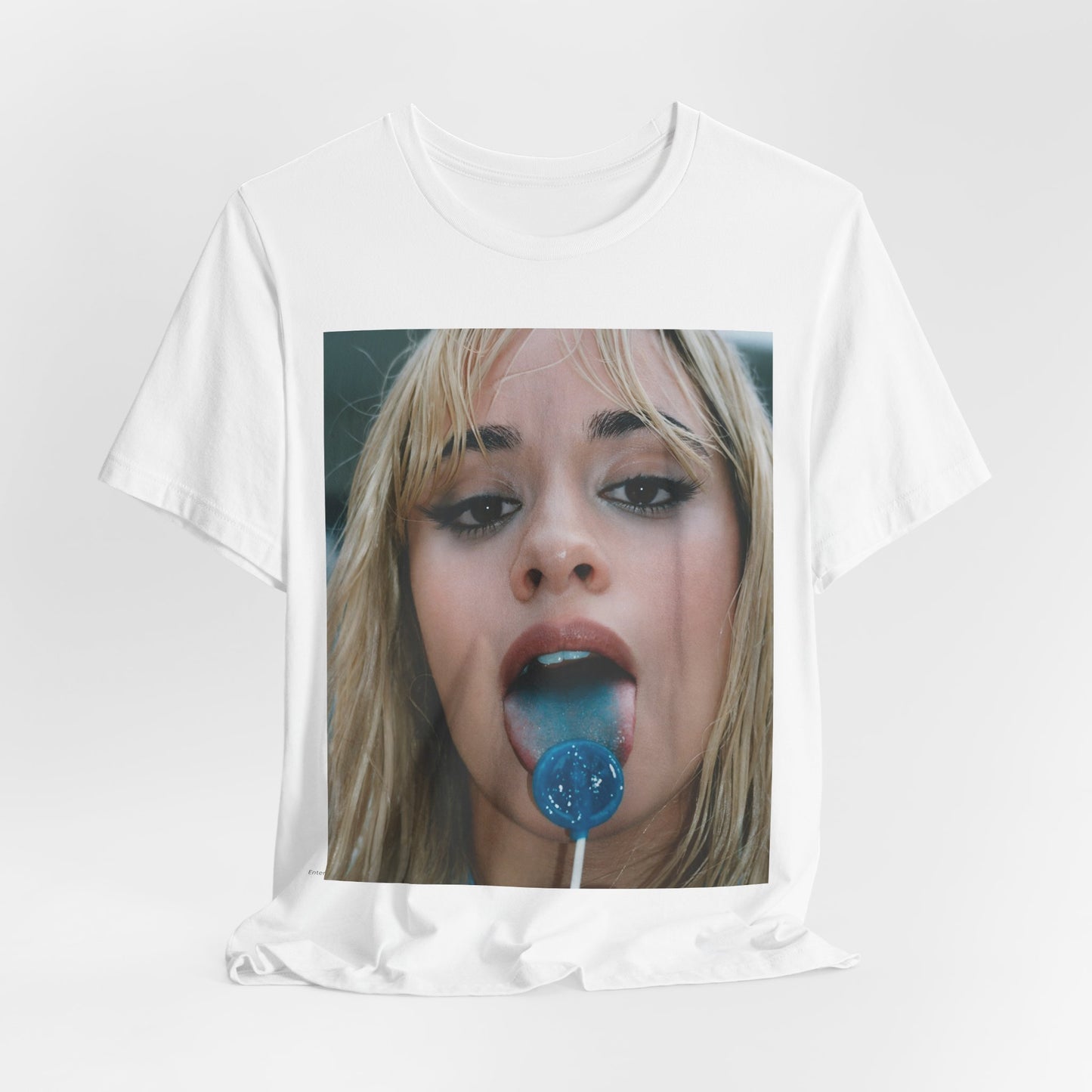 A black graphic t-shirt featuring a graphic related to Camila Cabello's C,XOXO album, with an aesthetic design.