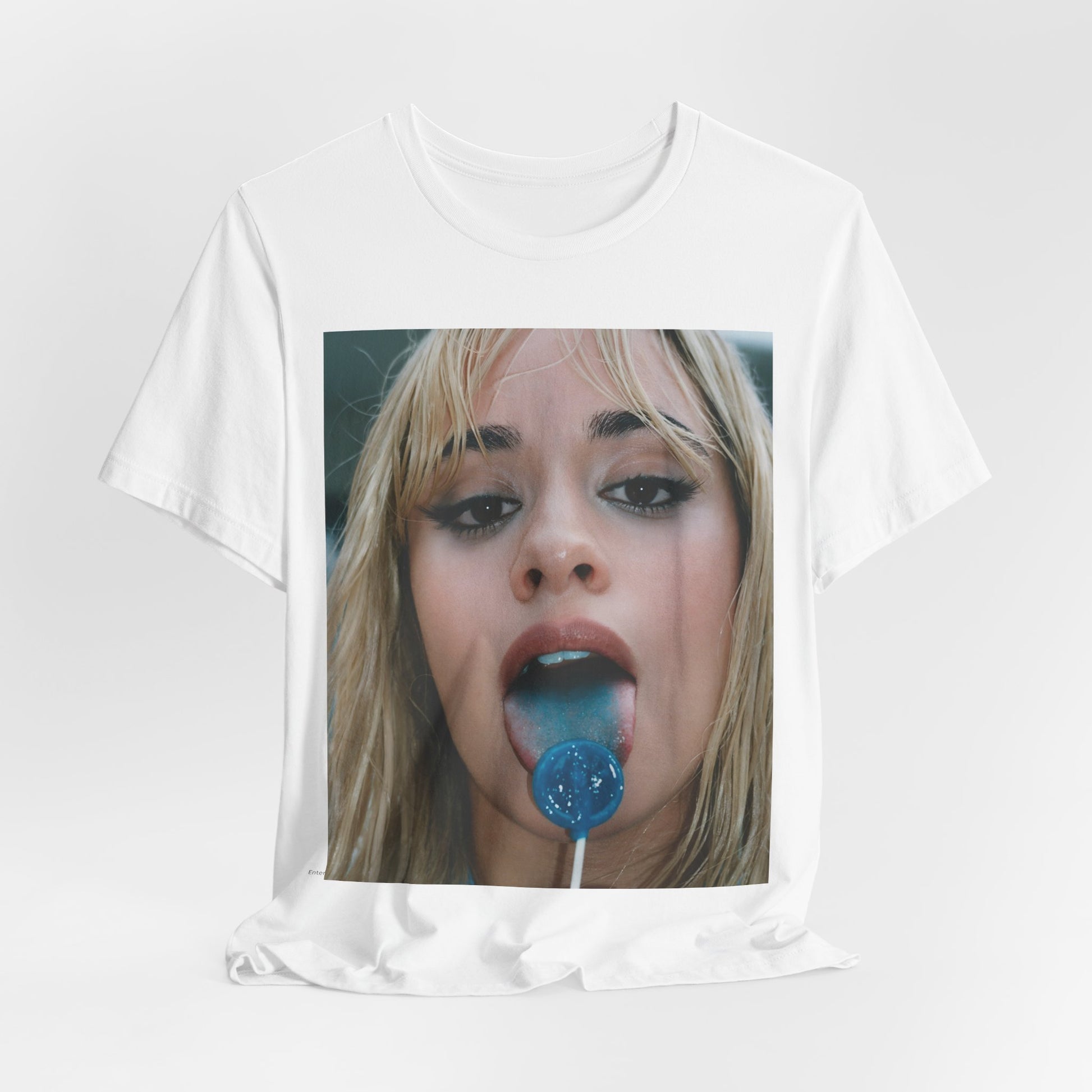 A black graphic t-shirt featuring a graphic related to Camila Cabello's C,XOXO album, with an aesthetic design.