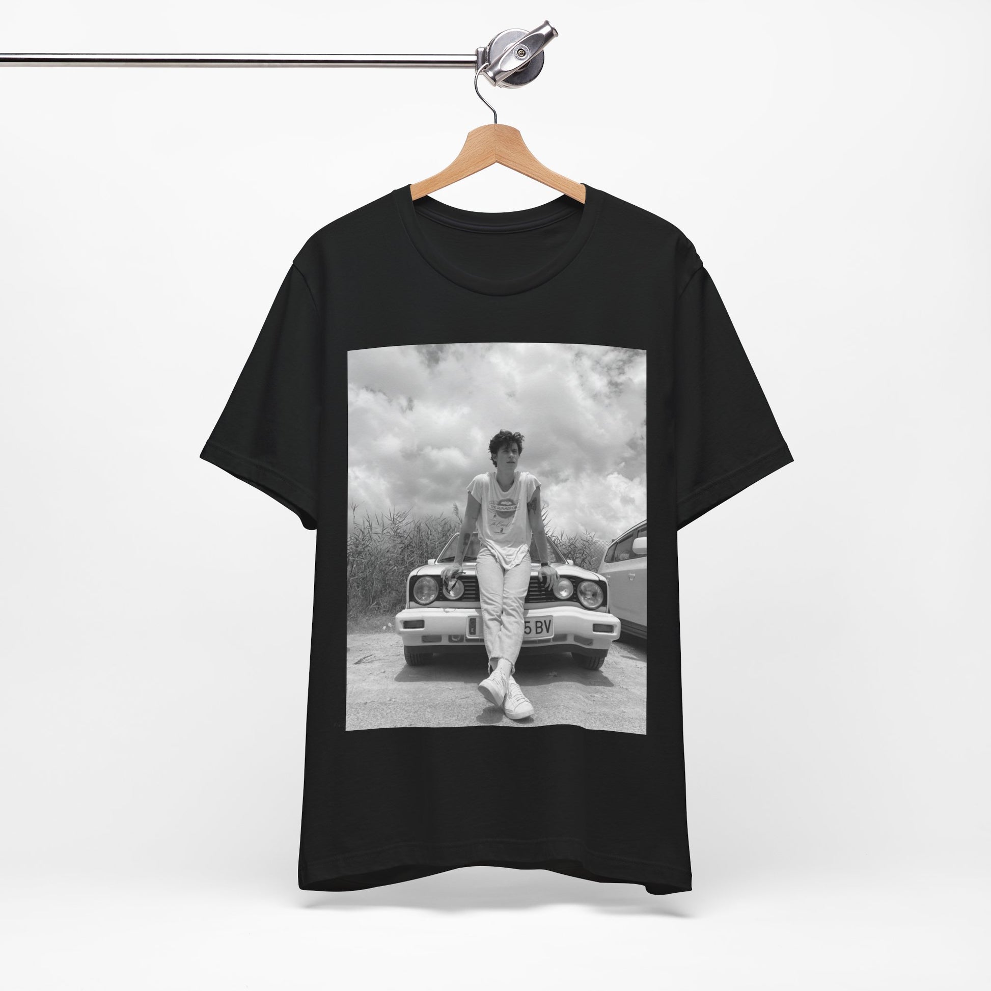 A black graphic t-shirt featuring a graphic of Shawn Mendes in an iconic tank top look.