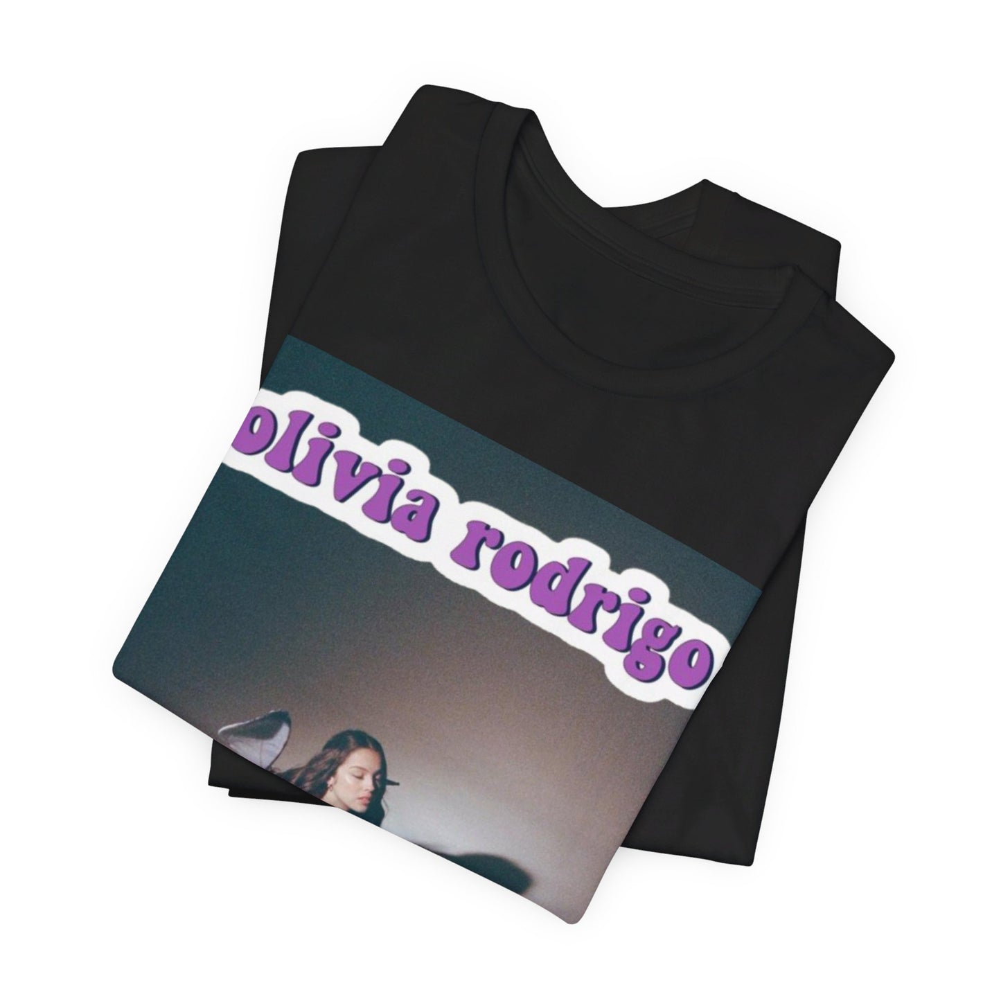 A black graphic t-shirt featuring a cool indie pop princess graphic of Olivia Rodrigo.