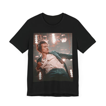 A black graphic t-shirt featuring a graphic or photo of Harry Styles performing live on concert tour.