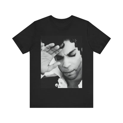 A black graphic t-shirt featuring a black and white graphic or photo portrait of Prince.