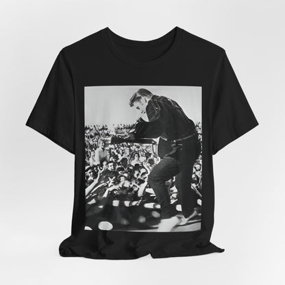 A black graphic t-shirt featuring a retro photo of Elvis Presley performing live in concert in the 1950s.