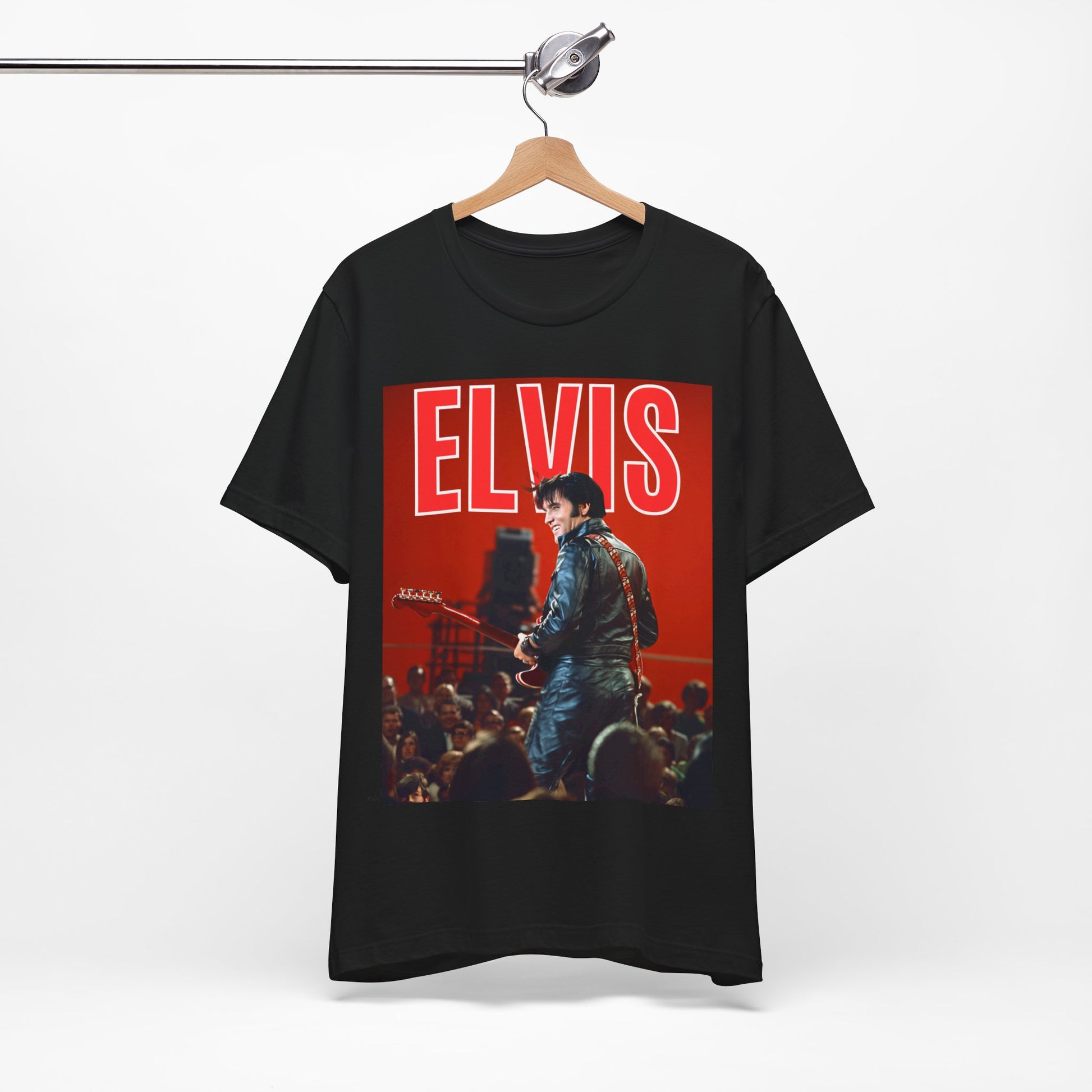 A black graphic t-shirt featuring a vintage graphic of Elvis Presley as the King of Rock 'n' Roll.