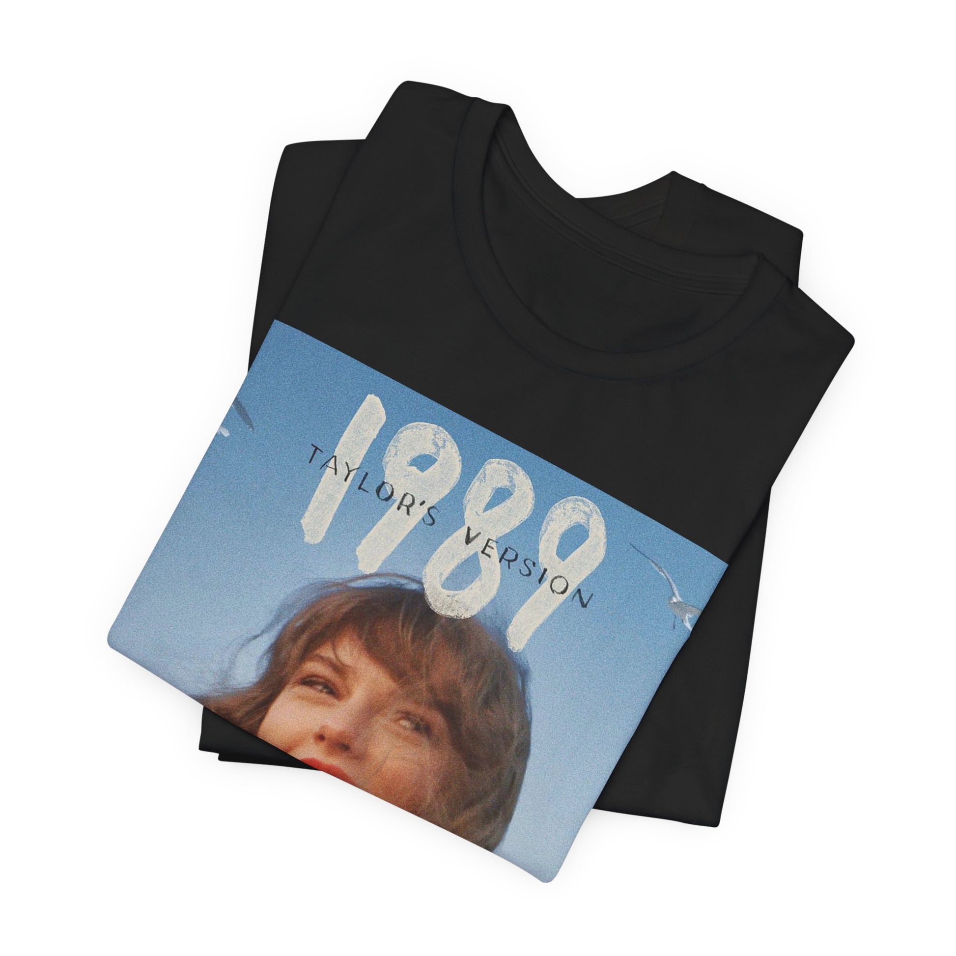 A black graphic t-shirt featuring a graphic related to Taylor Swift's 1989 album.