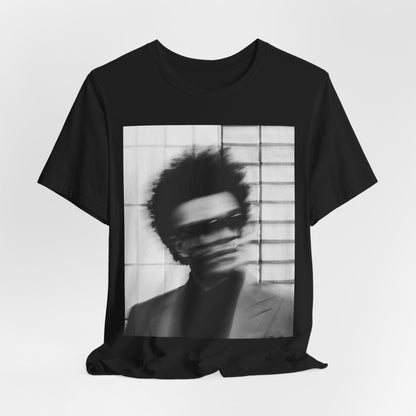 A black graphic t-shirt featuring a blurred graphic of The Weeknd from his 'After Hours' era.