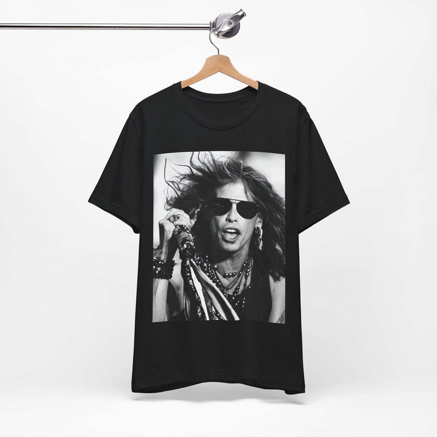 A black graphic t-shirt featuring a black and white photo of Aerosmith's Steven Tyler with his signature scarf and microphone, captured during a dynamic performance.