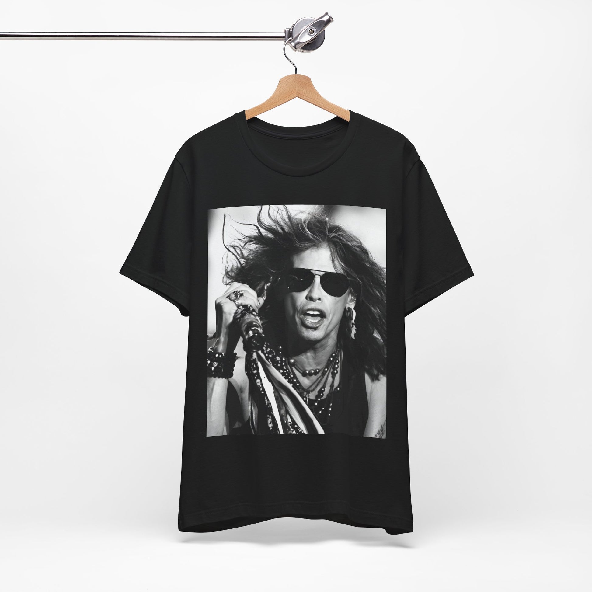 A black graphic t-shirt featuring a black and white photo of Aerosmith's Steven Tyler with his signature scarf and microphone, captured during a dynamic performance.