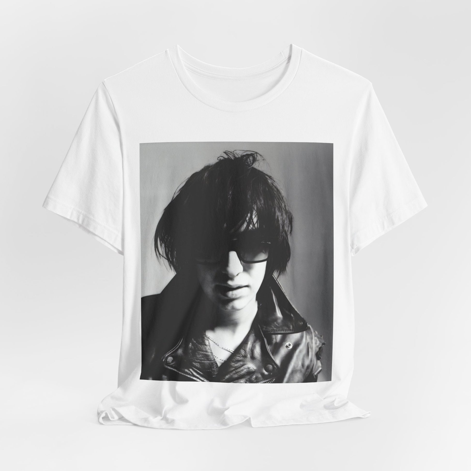 A black graphic t-shirt featuring a graphic related to The Strokes' 'Reptilia' song or era.