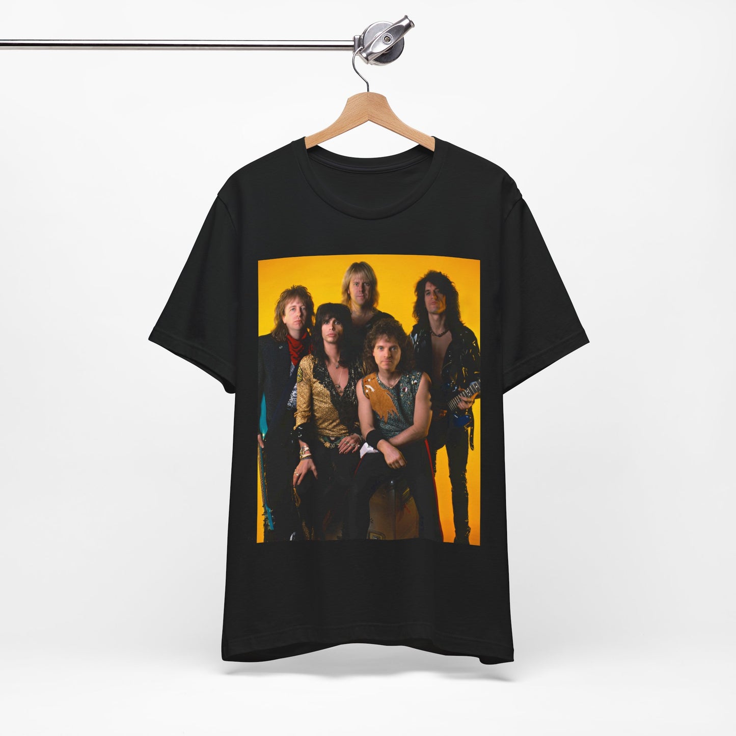 A black graphic t-shirt featuring a band photo of Aerosmith from the 1980s, showing the members in their iconic styles from that decade.