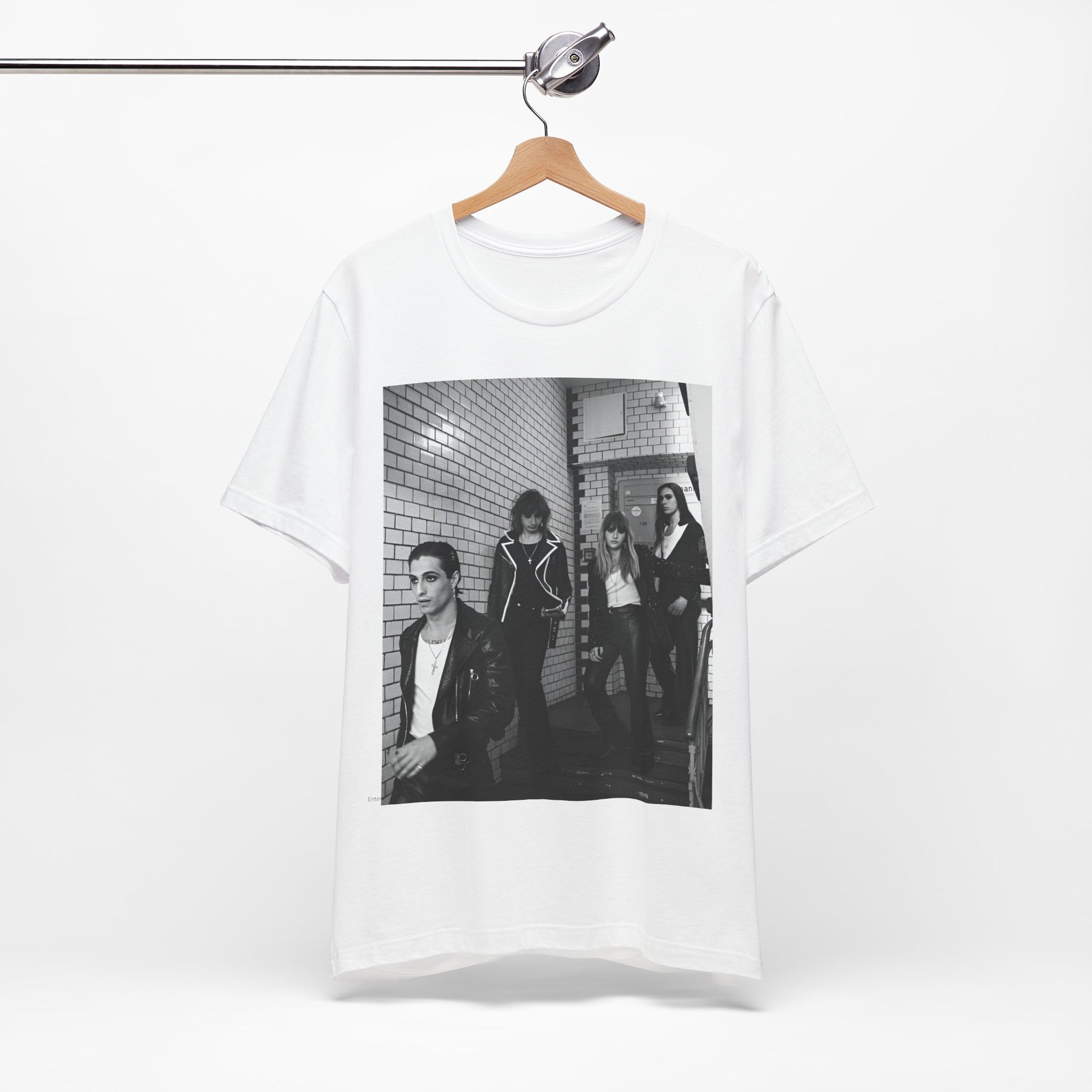 A black graphic t-shirt featuring a black and white graphic or photo of Maneskin in a backstage setting.