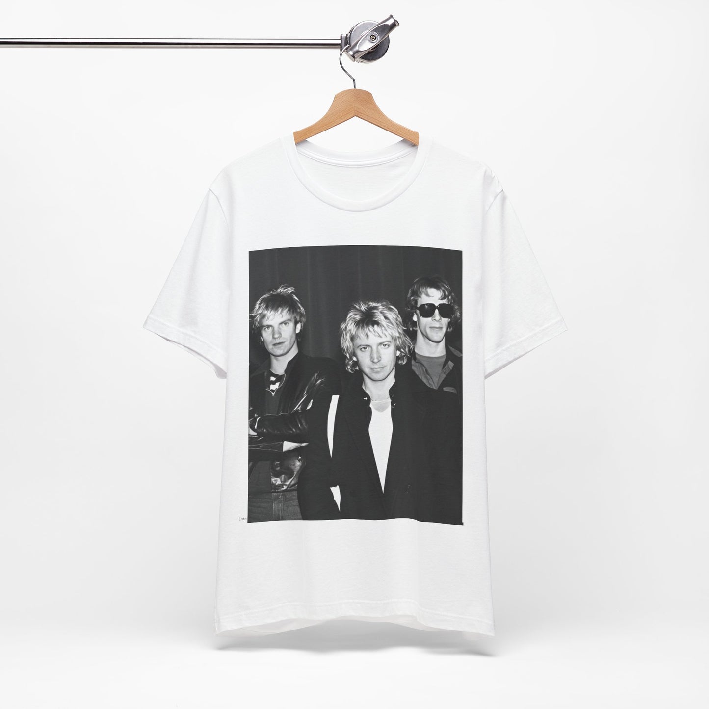 A black graphic t-shirt featuring a black and white, monochrome graphic or photo of The Police.