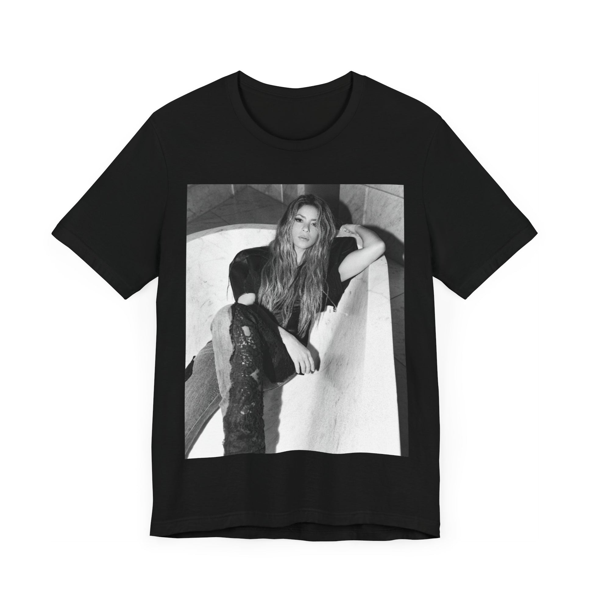 A black graphic t-shirt featuring a retro graphic related to Shakira's 'Hips Don't Lie' song or era.