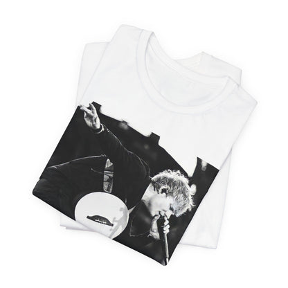 A black graphic t-shirt featuring a vintage graphic of Ed Sheeran performing live.