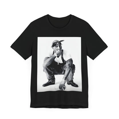 A black graphic t-shirt featuring a graphic of Tupac with a conscious rap vibe.