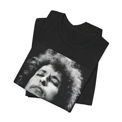 A black graphic t-shirt featuring a retro black and white graphic or photo of Bob Dylan performing live.