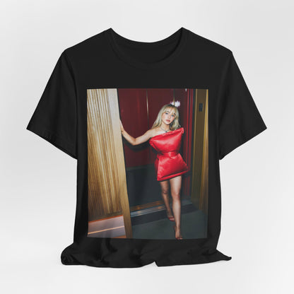 A black graphic t-shirt featuring a graphic of Sabrina Carpenter with 'hot pop vibes'.