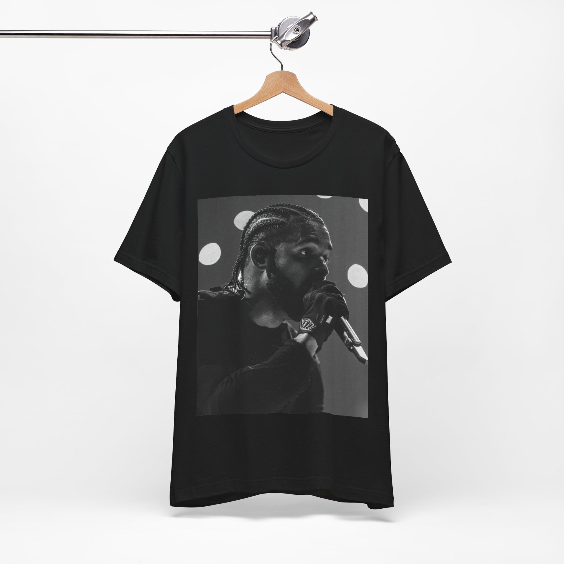 A black graphic t-shirt featuring a classic black and white style graphic of Drake.