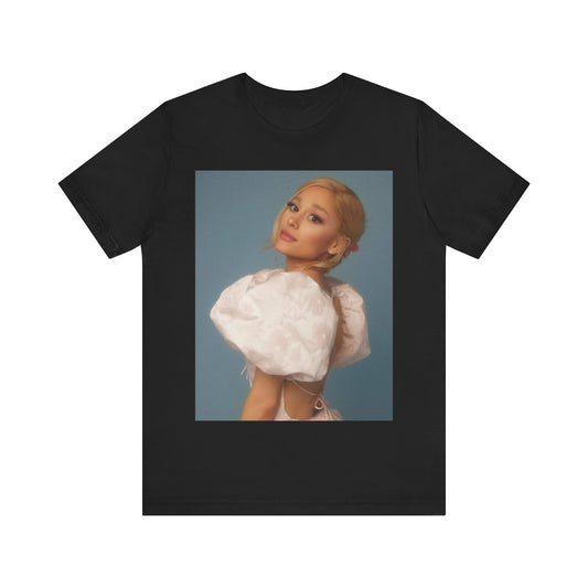 A black graphic t-shirt featuring a design related to Ariana Grande's 'Sweetener' album era, possibly with album art elements.