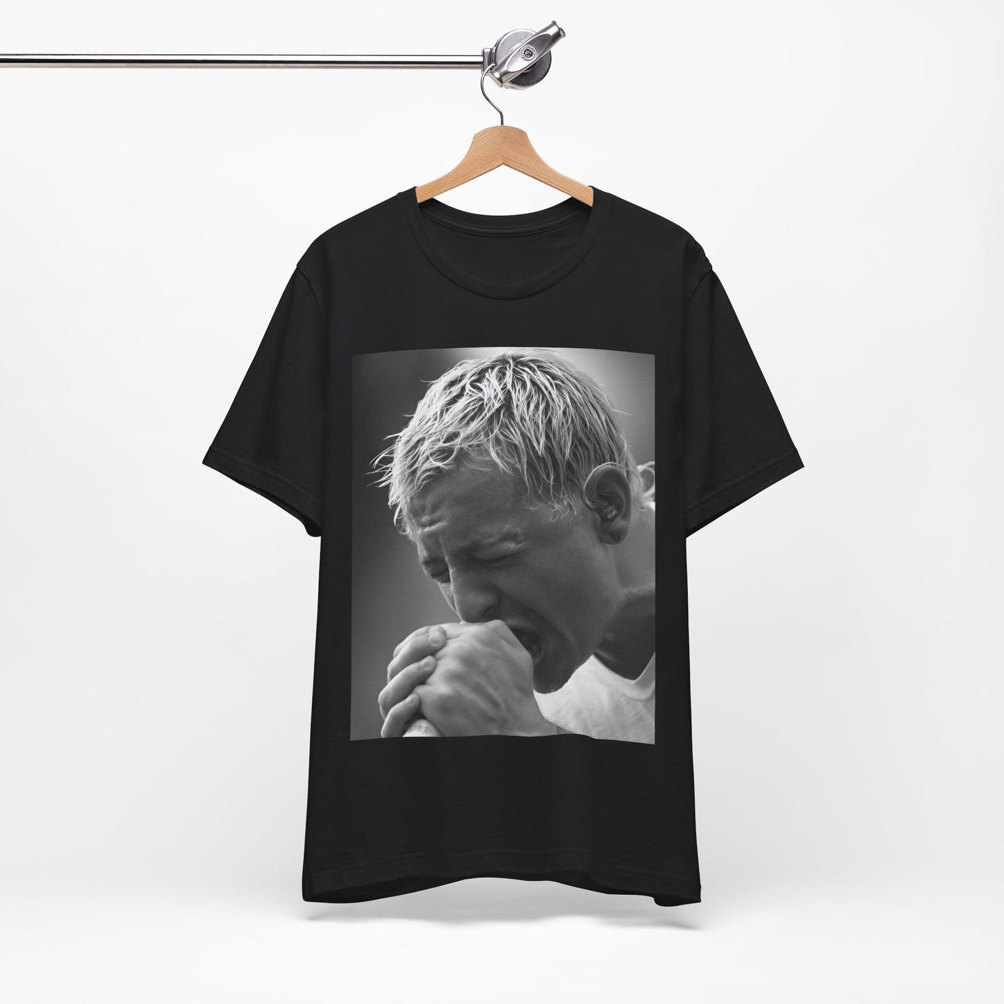 A black graphic t-shirt featuring a graphic or photo of Chester Bennington from Linkin Park performing live on stage.