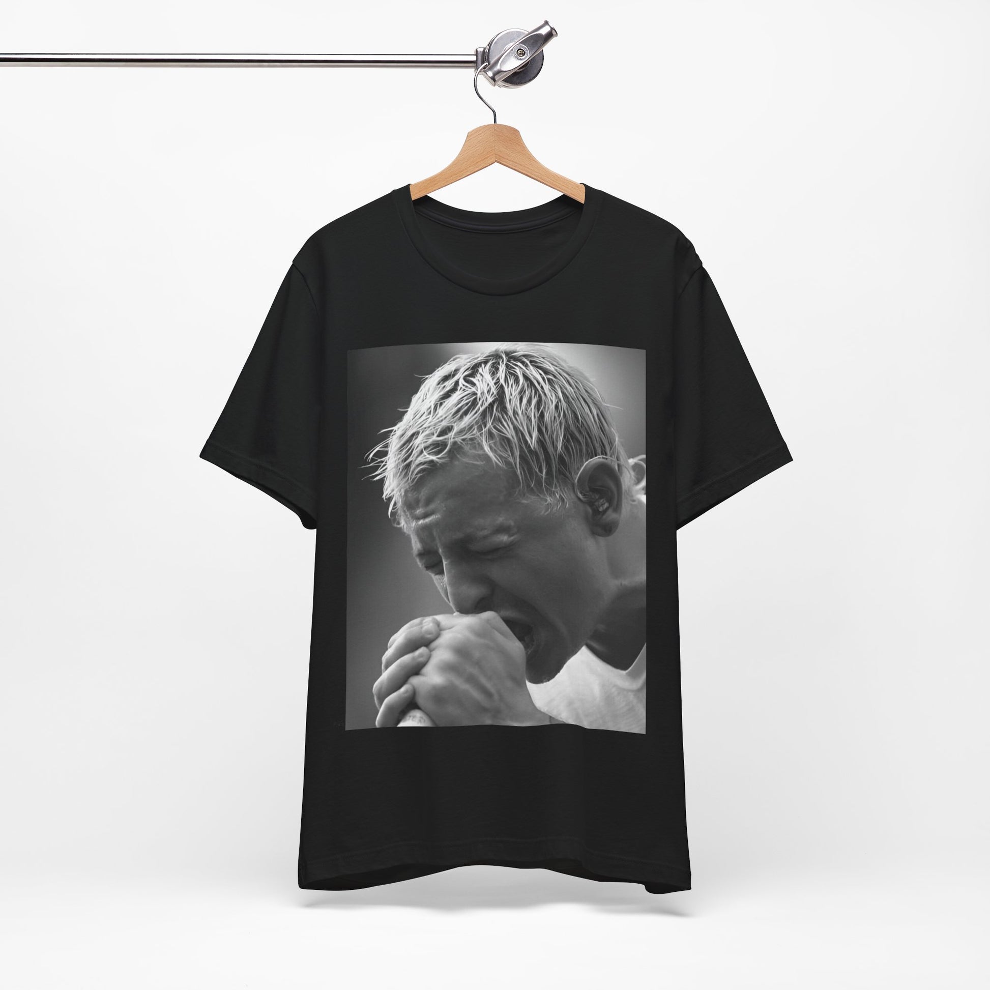 A black graphic t-shirt featuring a graphic or photo of Chester Bennington from Linkin Park performing live on stage.