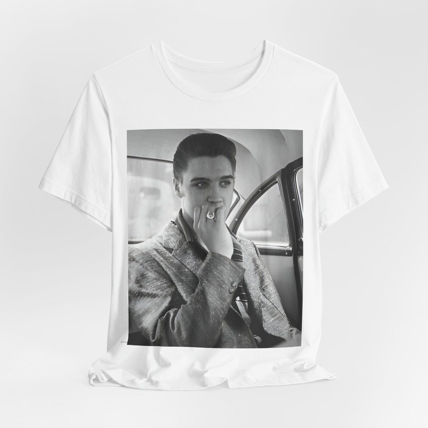 A black graphic t-shirt featuring a classic 50s era graphic of Elvis Presley.