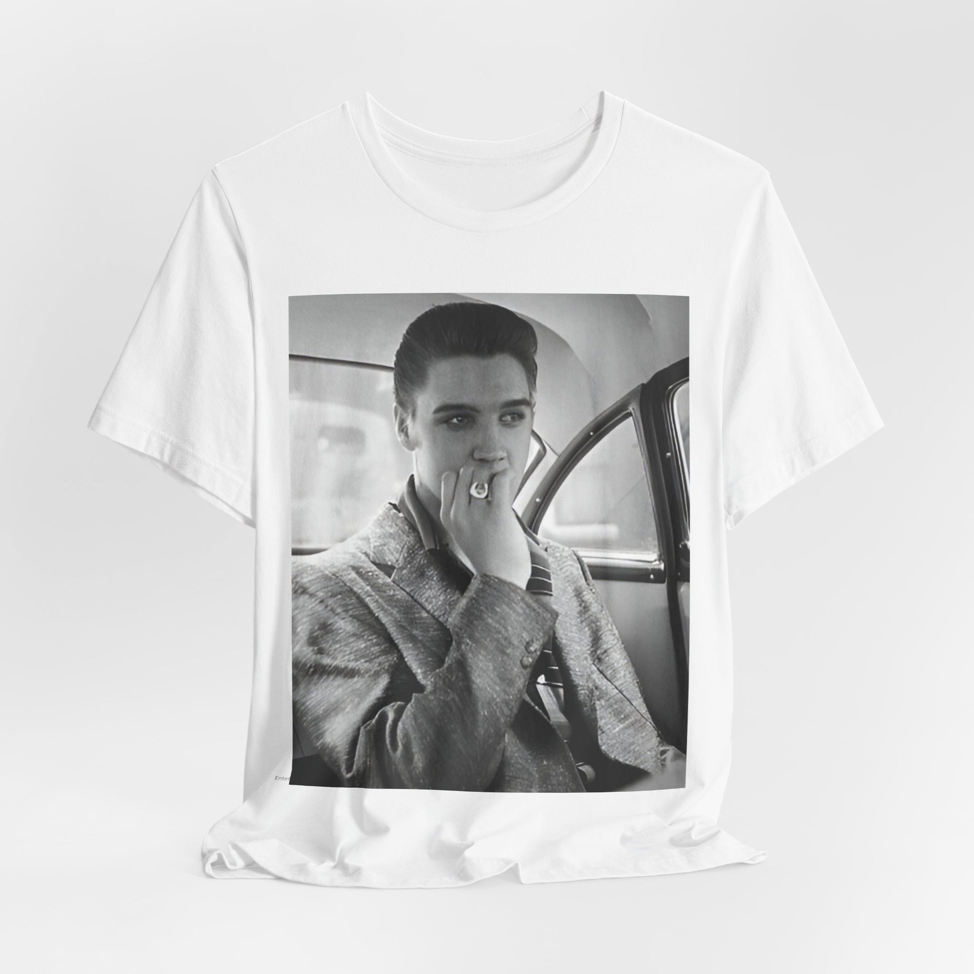 A black graphic t-shirt featuring a classic 50s era graphic of Elvis Presley.