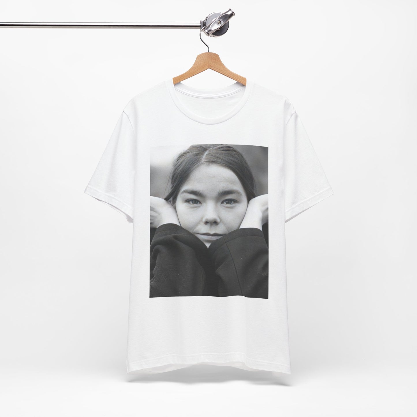 A black graphic t-shirt featuring a black and white portrait photo of Bjork.