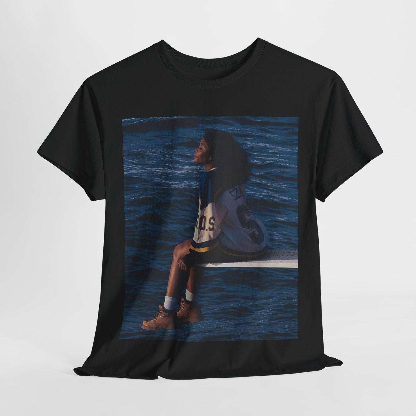 A black graphic t-shirt featuring a graphic related to SZA's 'SOS' album.