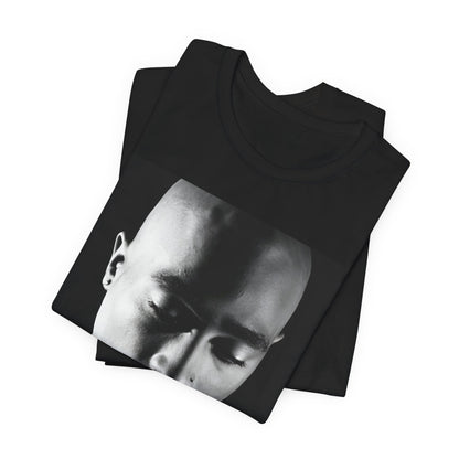 A black graphic t-shirt featuring a black and white streetwear rebel graphic of Tupac.