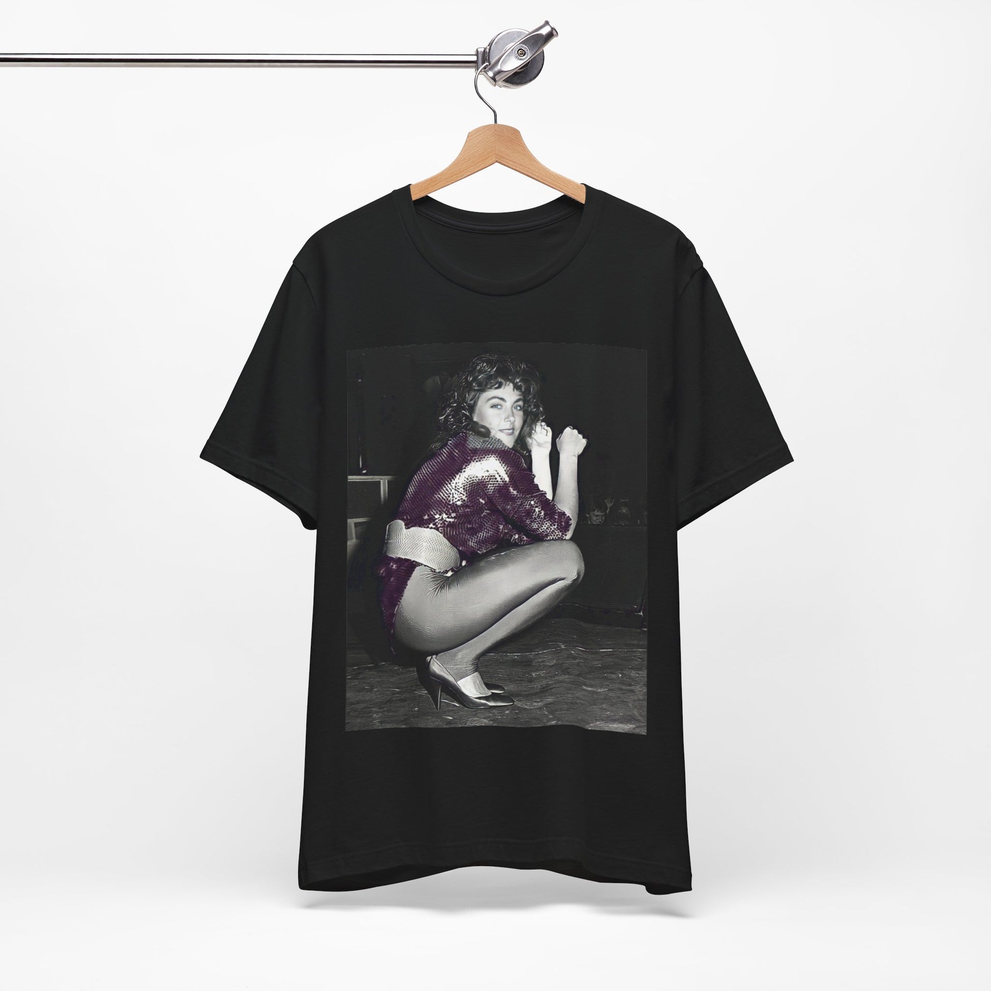 A black graphic t-shirt featuring a graphic of Laura Branigan as an 80s disco pop queen.