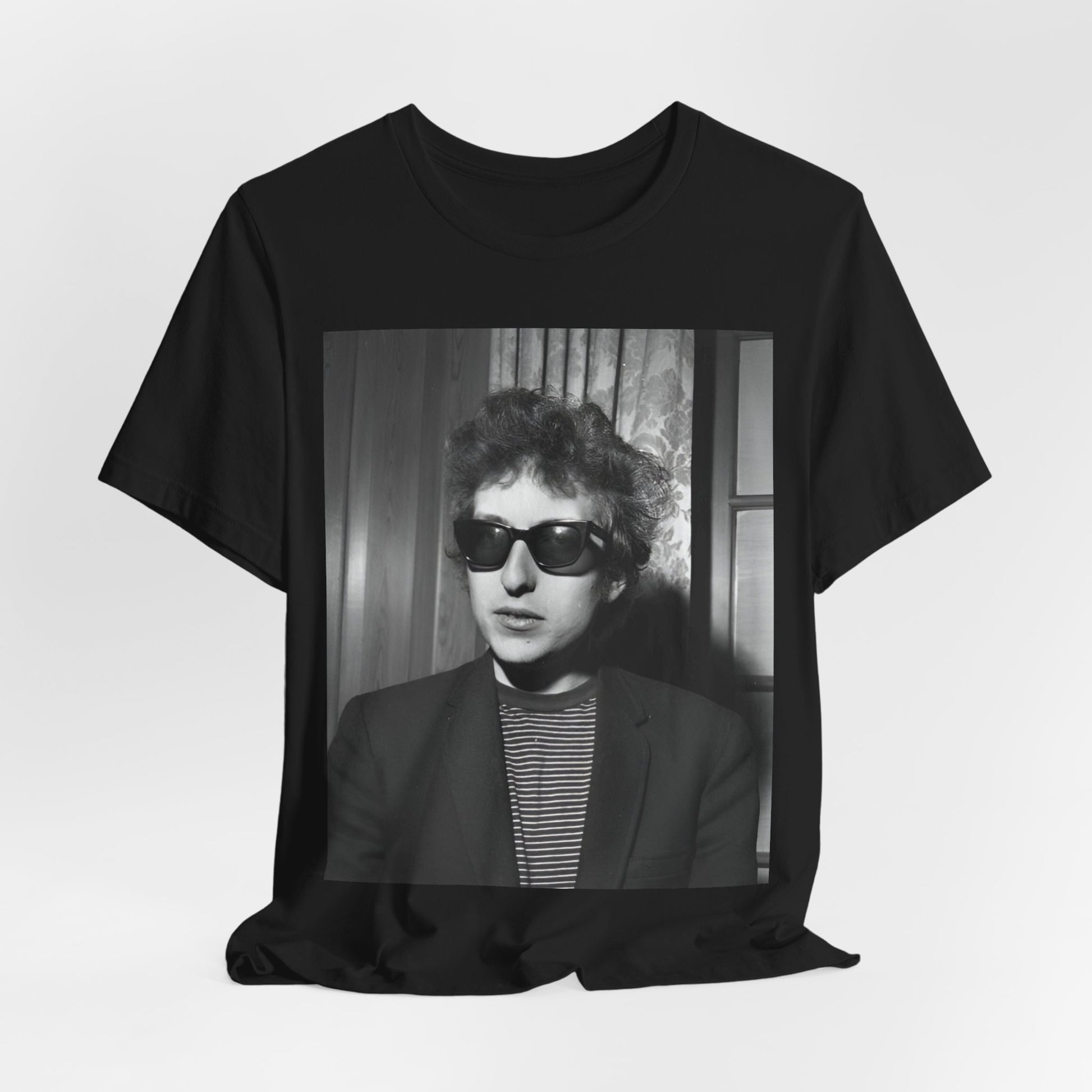 A black graphic t-shirt featuring a graphic related to Bob Dylan's 'The Freewheelin' album era.